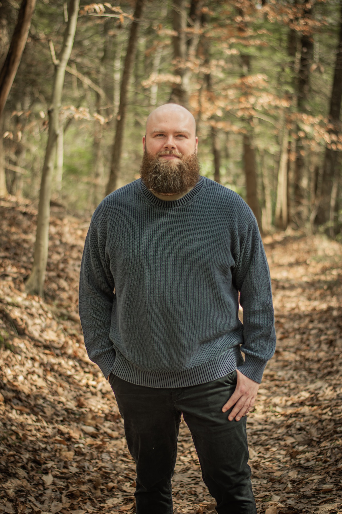 Portrait of Nate Lain outdoors in a wooded setting